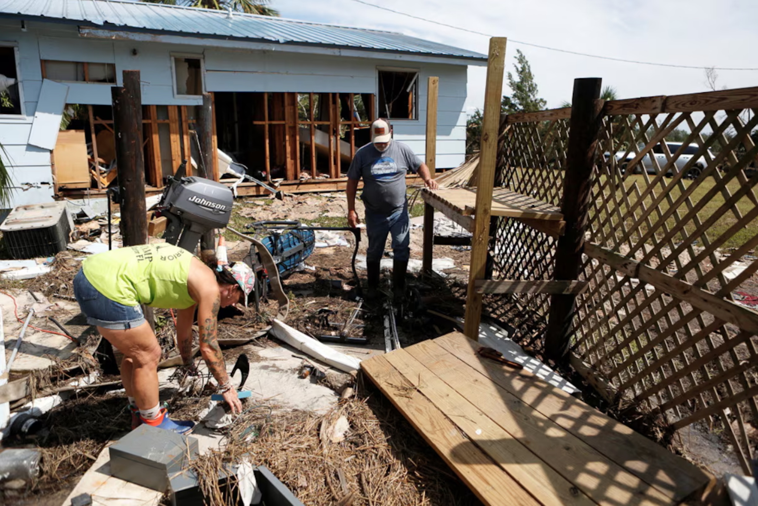 Leslie Merian and her husband David Hall survey the damage to their home and hotel after Hurricane Helene passed through the Florida panhandle, in Spring Warrior Fish Camp, Florida, U.S., September 28, 2024.