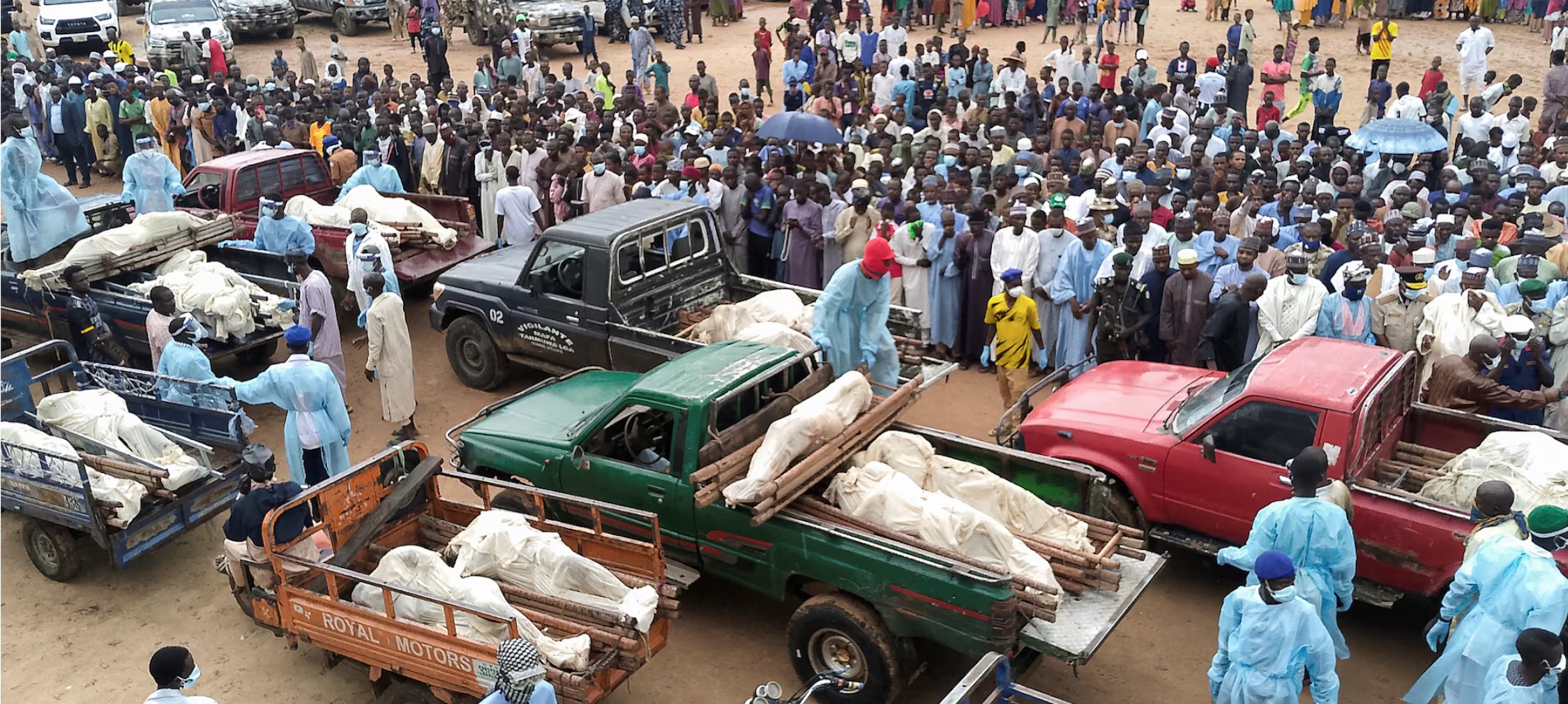 Trucks carry the wrapped bodies of people killed by suspected Boko Haram militants, during their funeral in Yobe, Nigeria September 3, 2024. REUTERS/Stringer