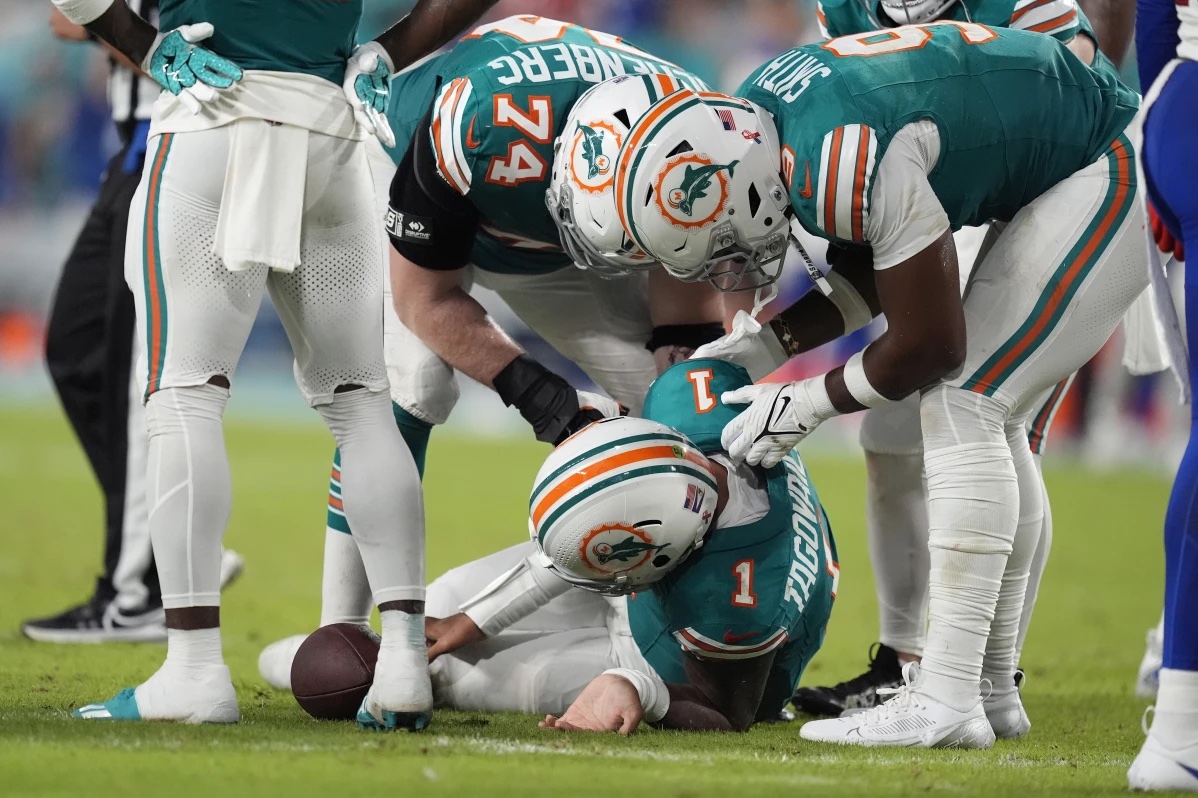 Miami Dolphins quarterback Tua Tagovailoa (1) lies on the field after suffering a concussion during the second half of an NFL football game against the Buffalo Bills, Thursday, Sept. 12, 2024, in Miami Gardens, Fla.