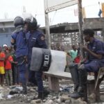 This image made from video shows police officers outside Makala prison in Kinshasa, Democratic Republic of the Congo, following an attempted jailbreak in Congo’s main prison Monday Sept. 2, 2024. (AP Photo)