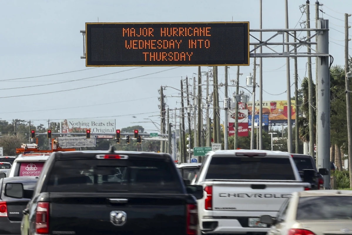 Highway signage announces the impending arrival of Hurricane Milton and the evacuations zones on Tuesday, Oct. 8, 2024, in Port Richey, Fla.