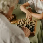 Persons playing chess.