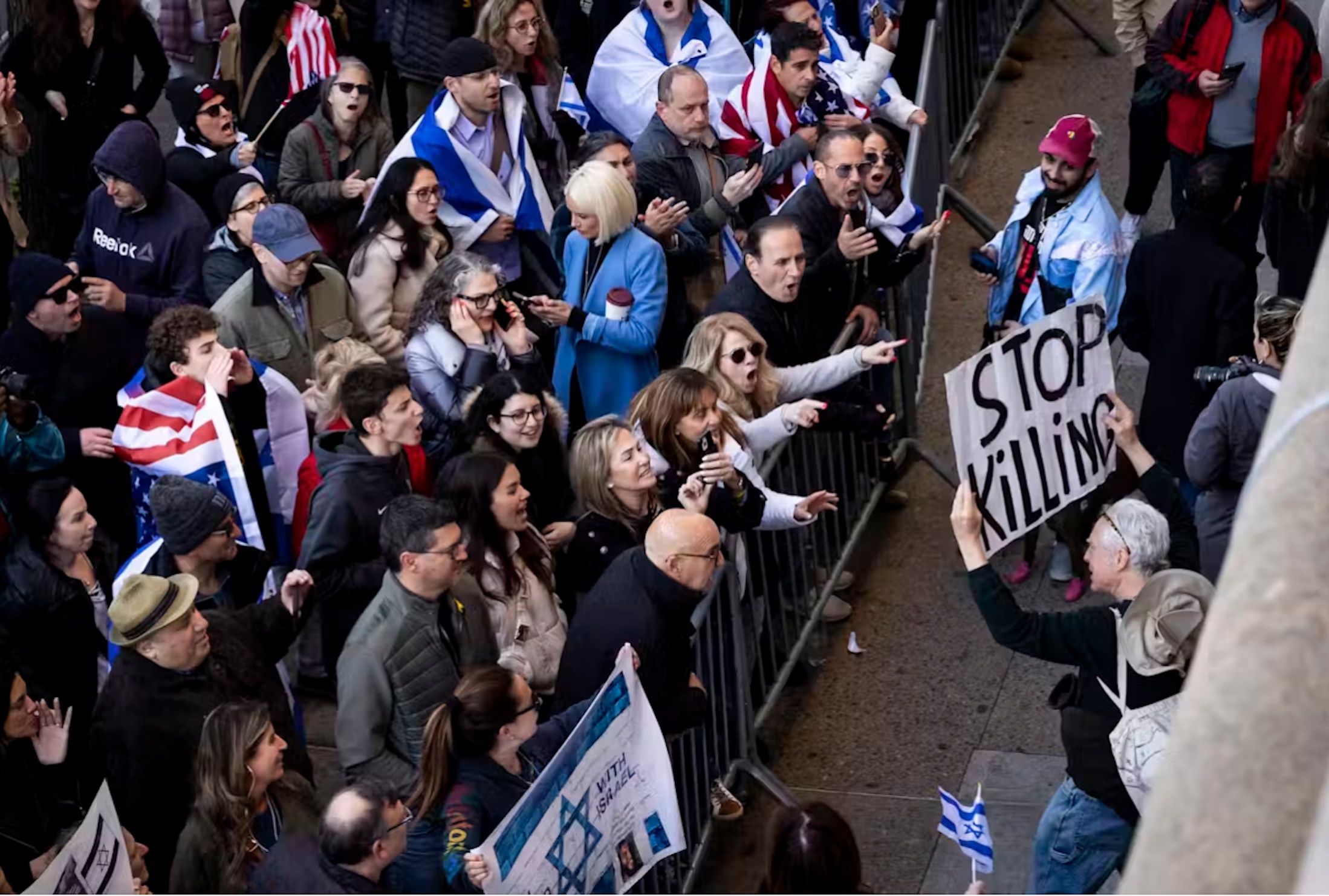 People participating in a ‘Stand with Israel’ rally shout at counter-protestors in New York in April 2024.