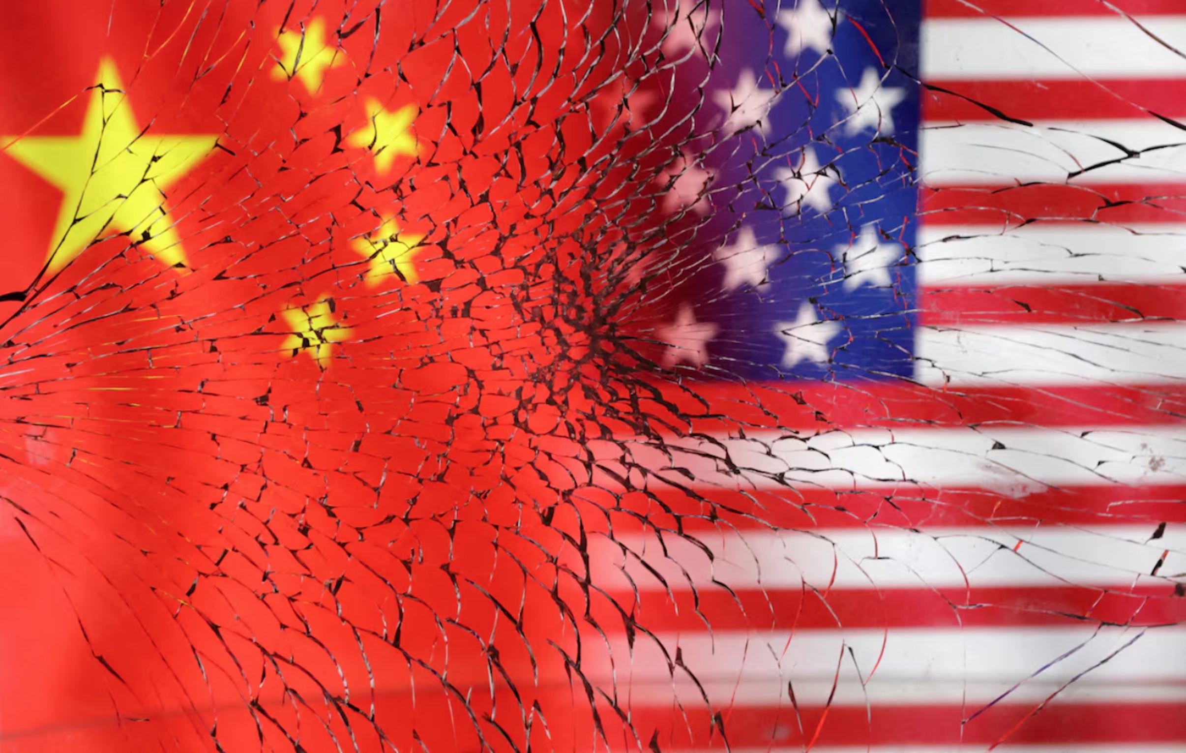 U.S. and Chinese flags are seen through broken glass in this illustration taken, January 30, 2023.