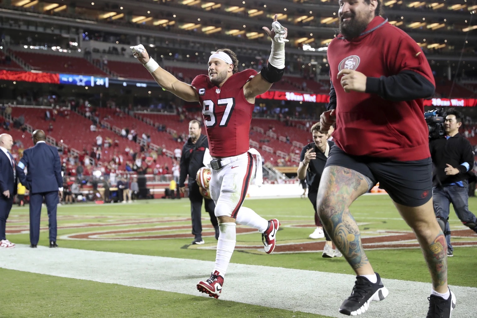 San Francisco 49ers’ Nick Bosa runs off the field after the 49ers’ win over the Dallas Cowboys in an NFL football game at Levi’s Stadium in Santa Clara, Calif., Sunday, Oct. 27, 2024.
