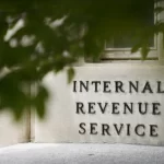 A sign is displayed outside the Internal Revenue Service building on May 4, 2021, in Washington.