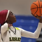 Lesley College basketball player Baileigh Sinaman-Daniel lines up a foul shot while practicing prior to game, Tuesday, Feb. 11, 2025, in Lexington, Mass.