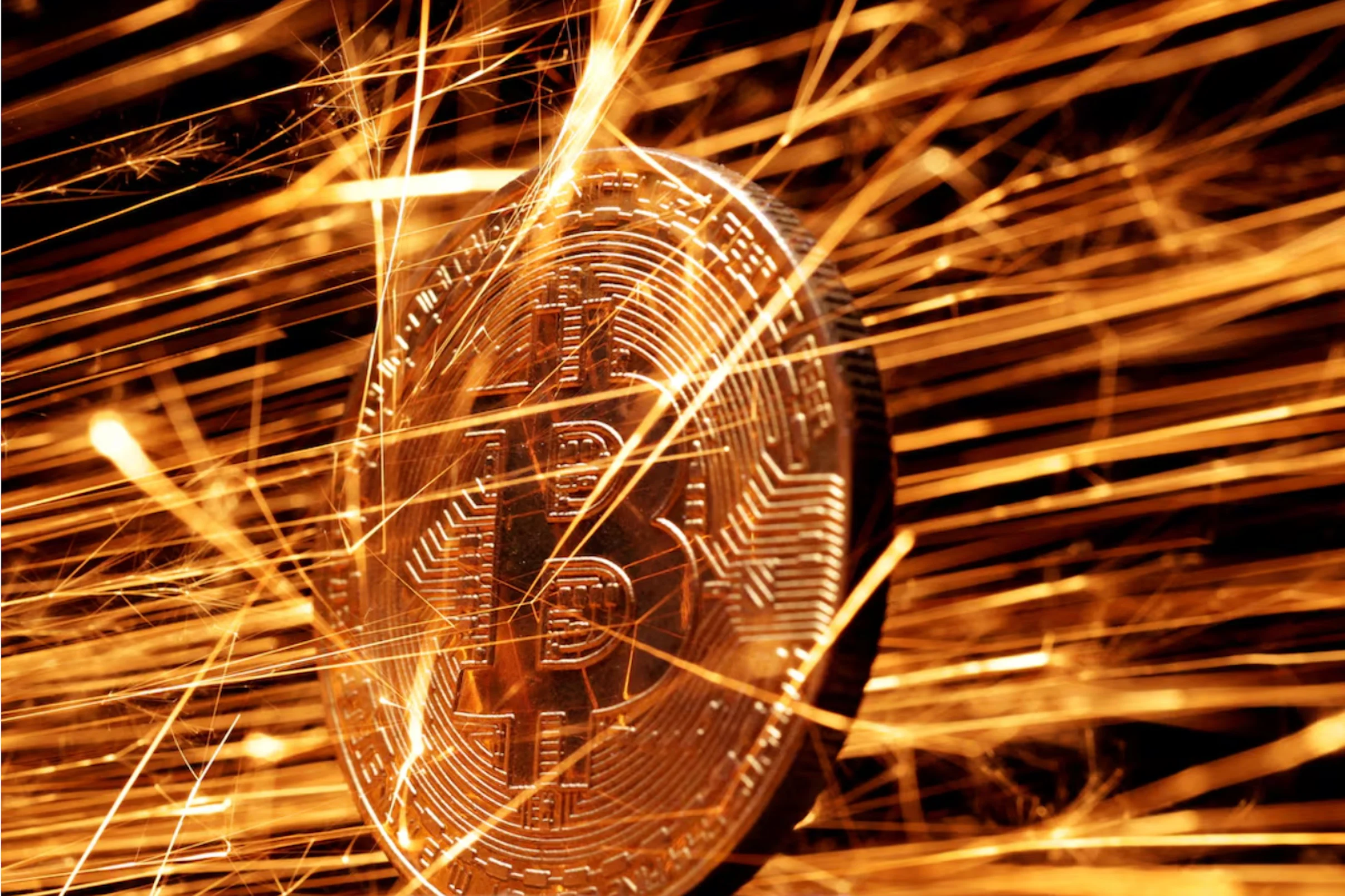 Sparks strike representation of cryptocurrency Bitcoin in this illustration taken November 24, 2024.