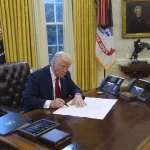 President Donald Trump signs executive orders in the Oval Office at the White House, Thursday, Jan. 30, 2025, in Washington.