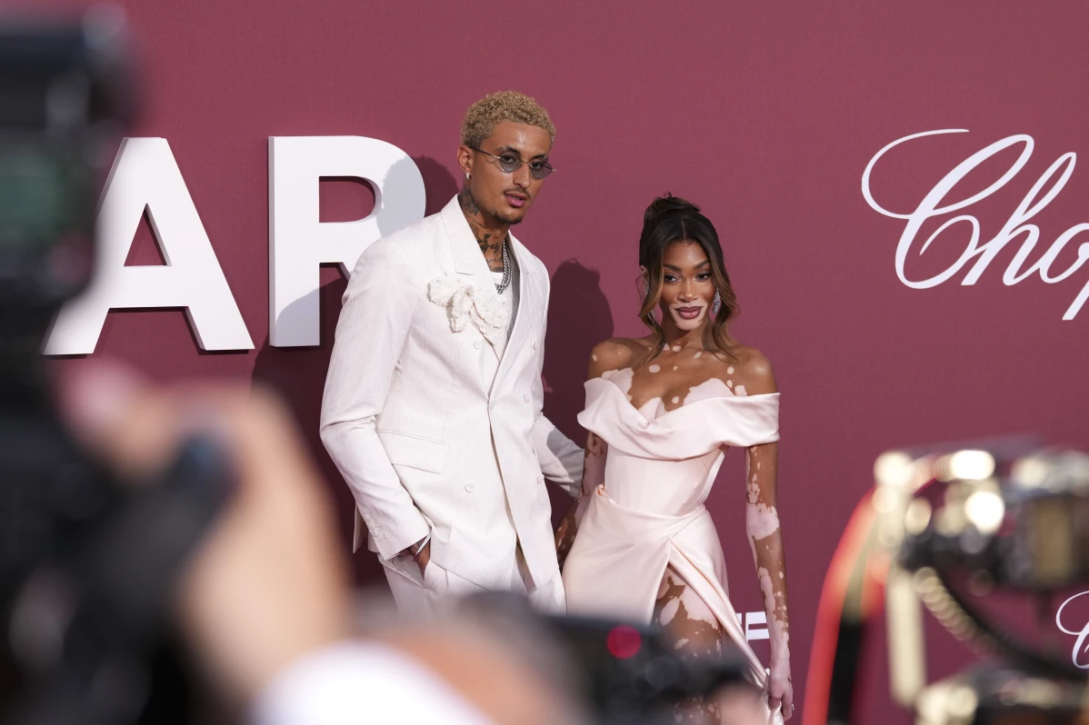 Kyle Kuzma, left and Winnie Harlow pose for photographers upon arrival at the amfAR Cinema Against AIDS benefit at the Hotel du Cap-Eden-Roc, during the 77th Cannes international film festival, Cap d’Antibes, southern France, May 23, 2024.