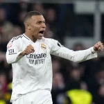 Real Madrid’s Kylian Mbappe celebrates after scoring his side’s first goal during a Spanish La Liga soccer match between Real Madrid and Atletico Madrid at the Santiago Bernabeu stadium in Madrid, Saturday, Feb. 8, 2025.