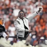 Entertainer Nelly performs at halftime of the Big 12 Conference championship NCAA college football game between Oklahoma State and Texas in Arlington, Texas, Saturday, Dec. 2, 2023.