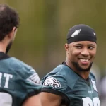 Philadelphia Eagles running back Saquon Barkley talks with tight end Dallas Goedert during an NFL football practice Thursday, Feb. 6, 2025, in New Orleans, ahead of Super Bowl 59 against the Kansas City Chiefs.