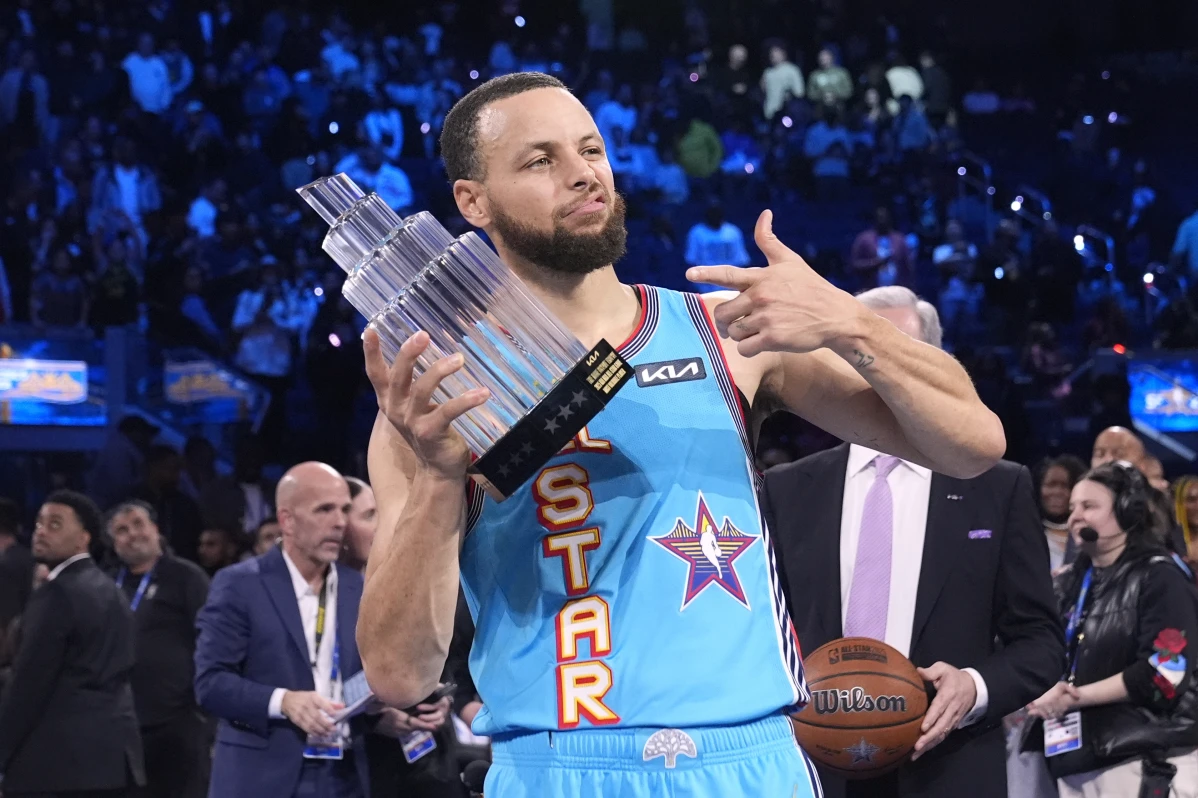 Golden State Warriors guard Stephen Curry holds the Most Valuable Player trophy after the NBA All-Star basketball game Sunday, Feb. 16, 2025, in San Francisco.