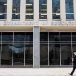 A pedestrian walks past the Lyndon Baines Johnson Department of Education Building on Feb. 3, 2025, in Washington.