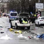 Emergency services attend the scene of an accident after a driver hit a group of people in Munich, Germany, Thursday Feb. 13, 2025.