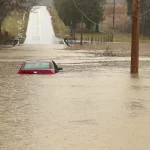 This photo provided by the Warren County, Ky., Sheriff’s Office shows a partially submerged car outside of Bowling Green, Ky., on Saturday, Feb. 15, 2025.