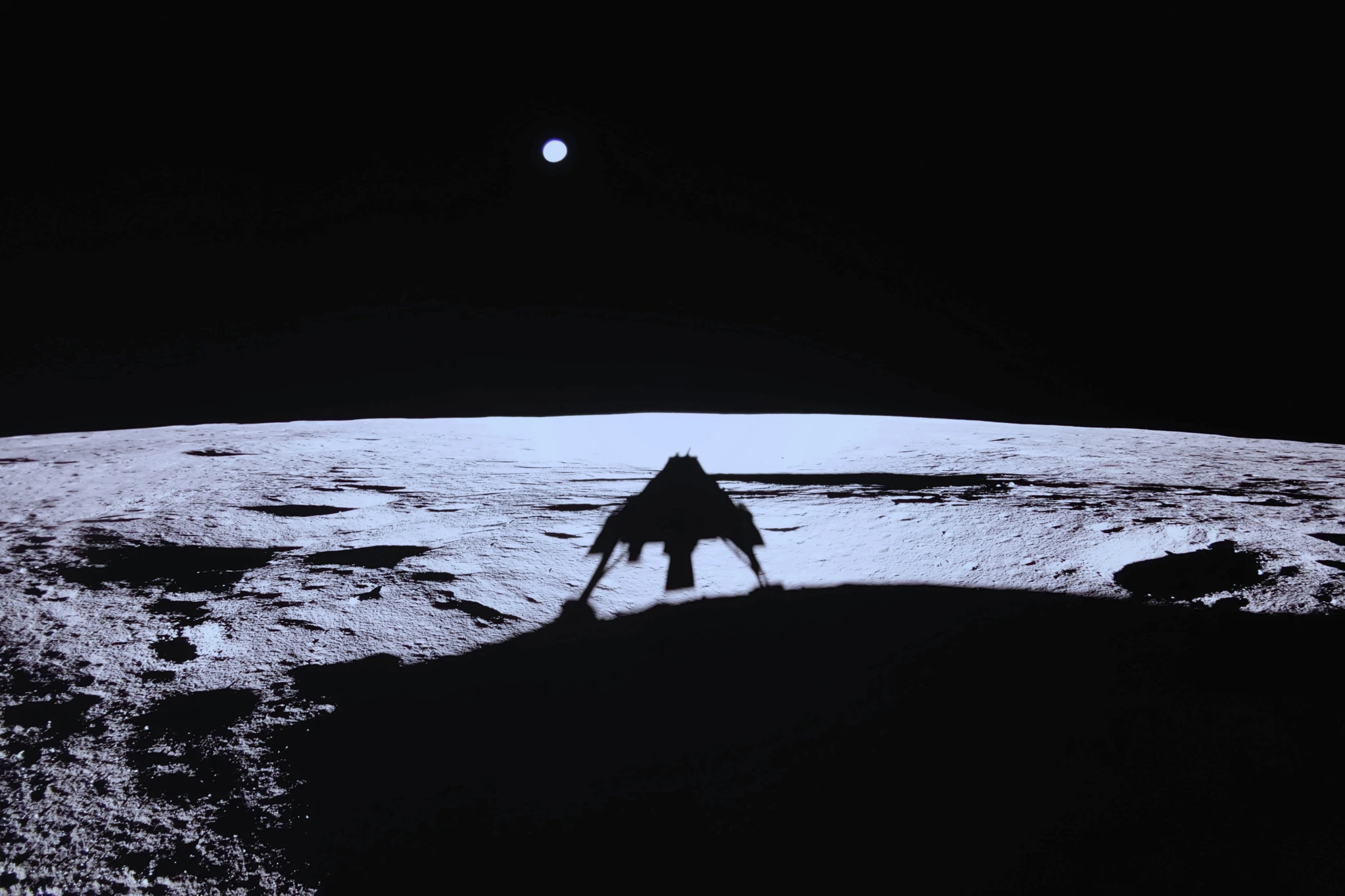Private lunar lander Blue Ghost’s shadow is seen on the moon’s surface after touching down on the moon with a special delivery for NASA, Sunday, March 2, 2025.
