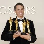 Sean Baker, winner of the awards for best original screenplay, best film editing, best director, and best picture for “Anora,” poses in the press room at the Oscars on Sunday, March 2, 2025, at the Dolby Theatre in Los Angeles. (Photo by Jordan Strauss/Invision/AP) poses in the press room at the Oscars on Sunday, March 2, 2025, at the Dolby Theatre in Los Angeles.