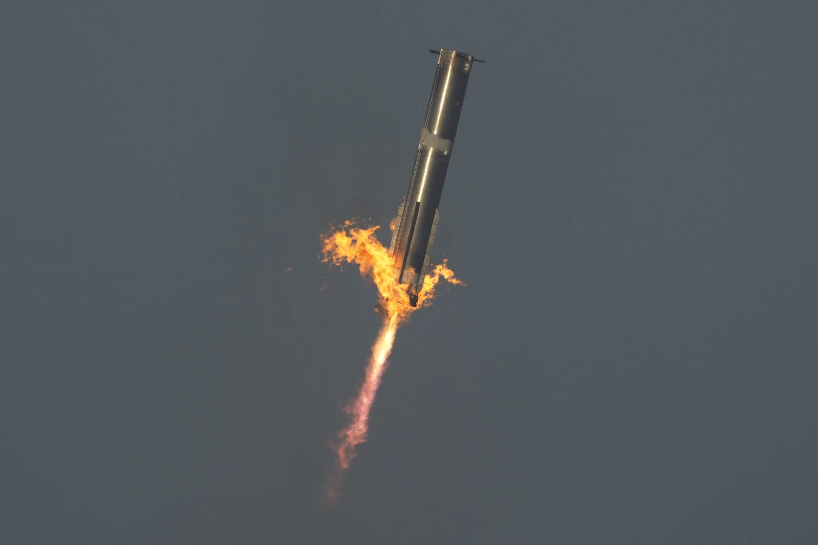 The booster of SpaceX’s mega rocket Starship is recaptured during a test flight from Starbase in Boca Chica, Texas, Thursday, March 6, 2025.