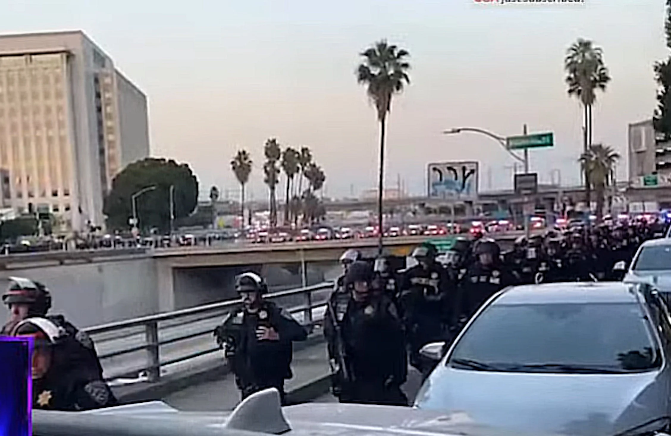 Cops mobilized in LA for the curfew.