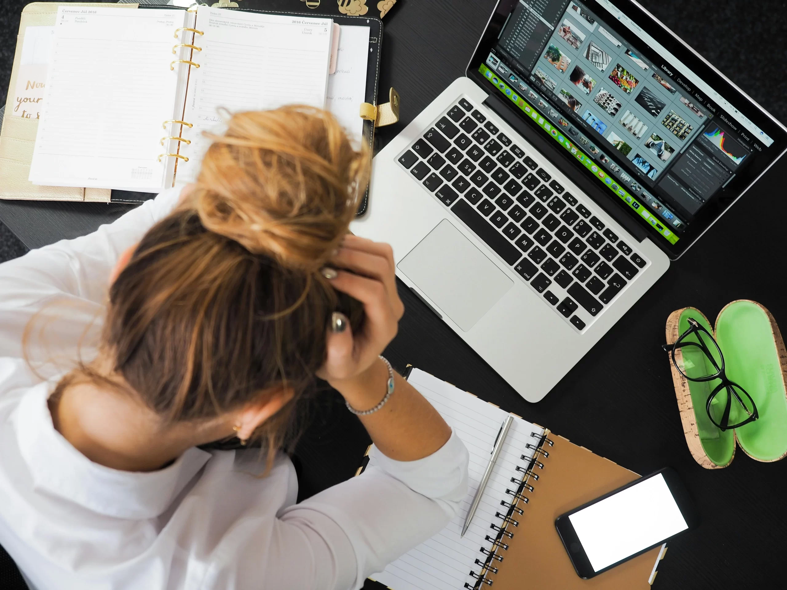 A woman in front of macbook.