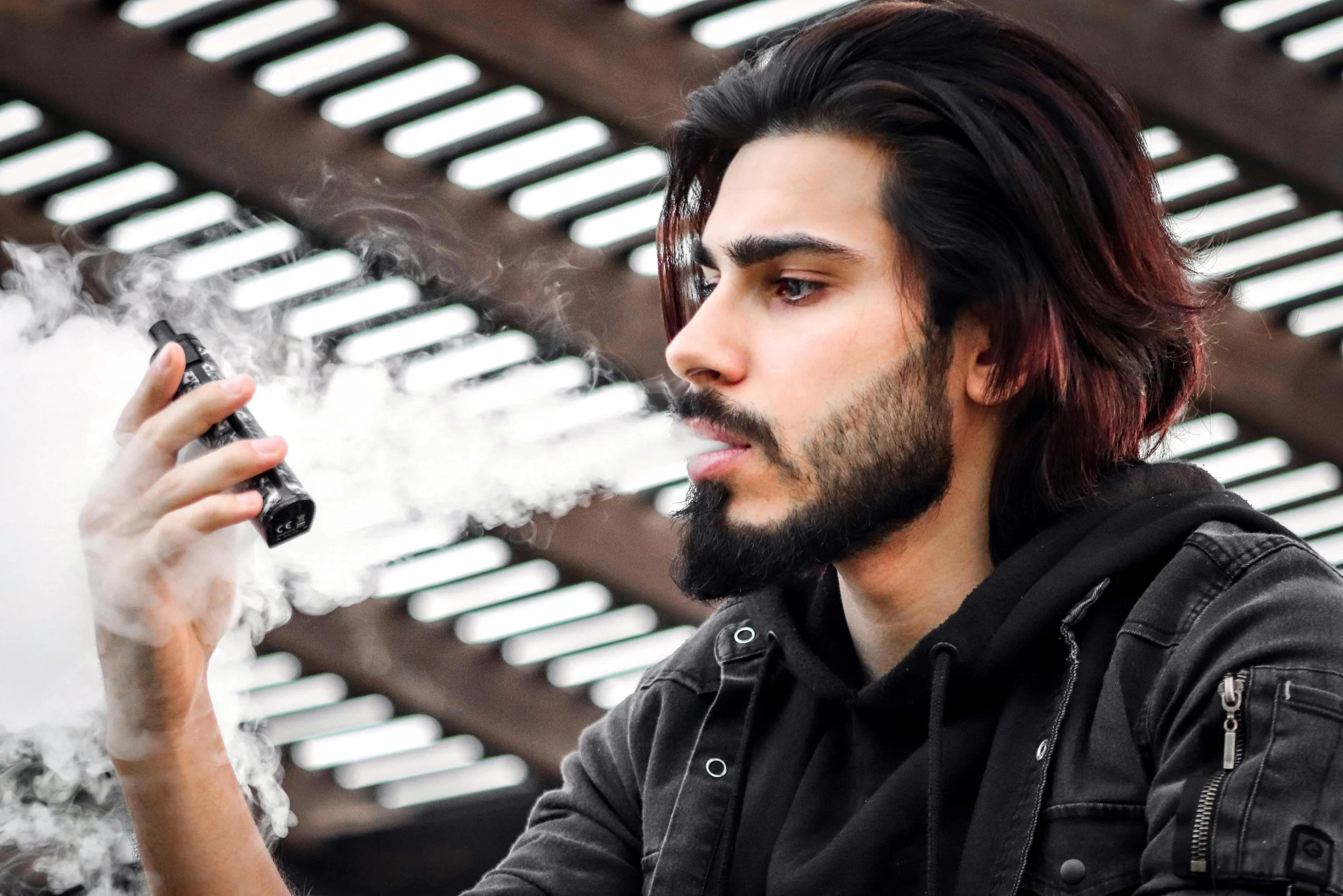 A man smocking e-cigarette.