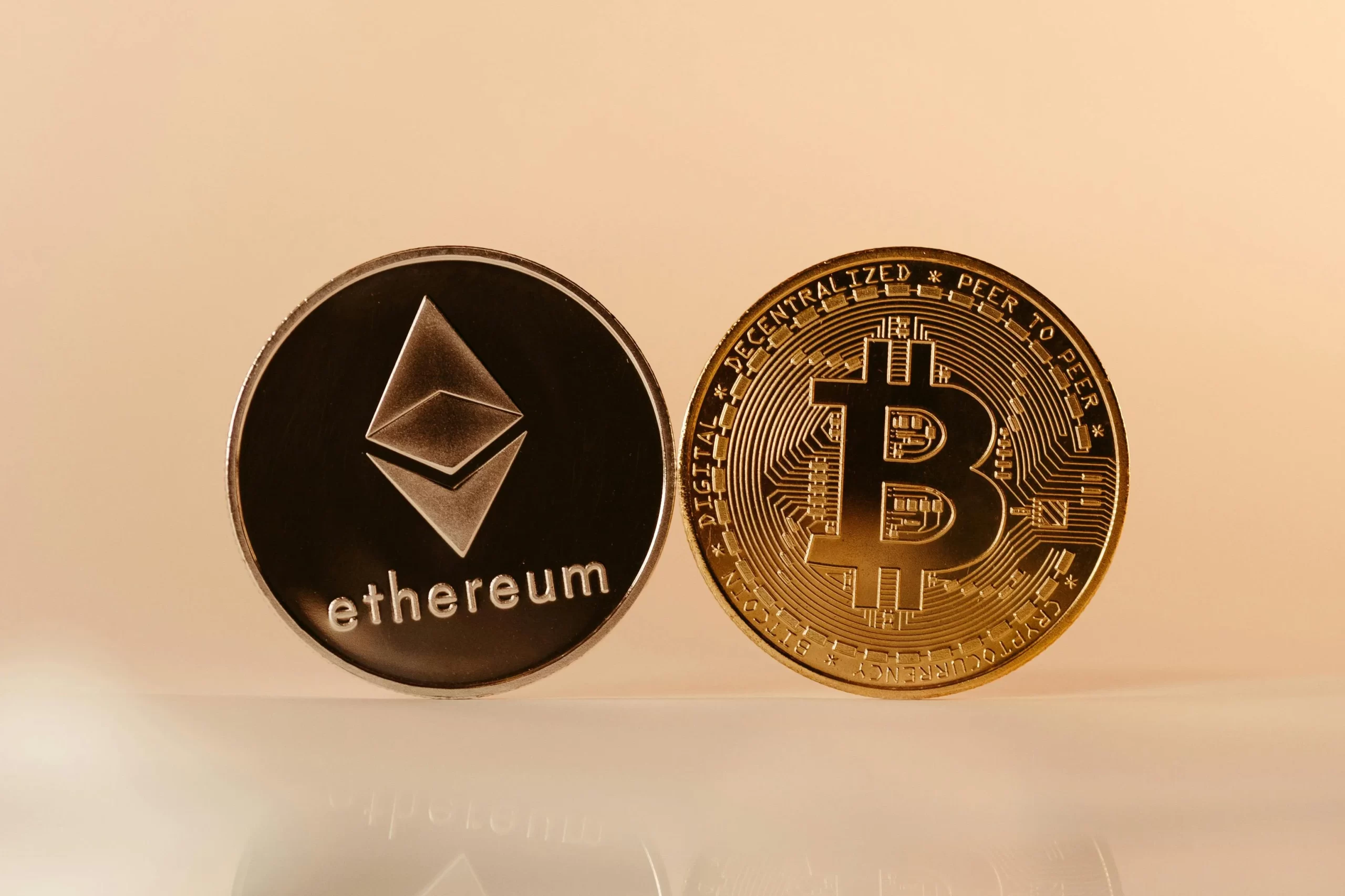 Bitcoin and Ethereum cryptocurrency coins.