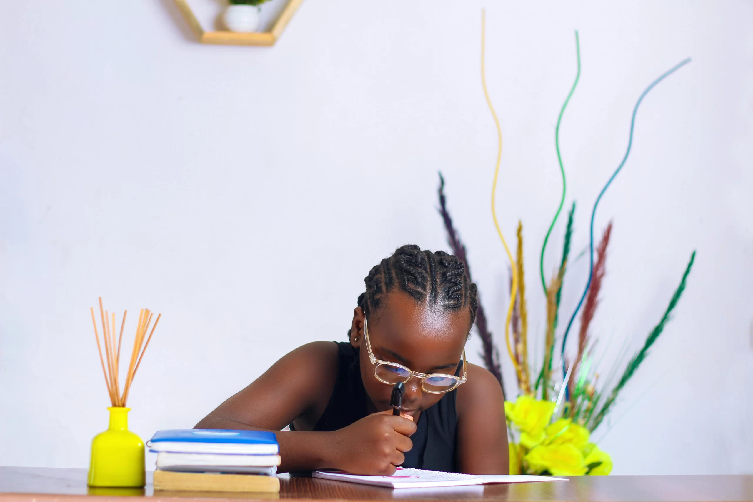 A young girl studying at home.