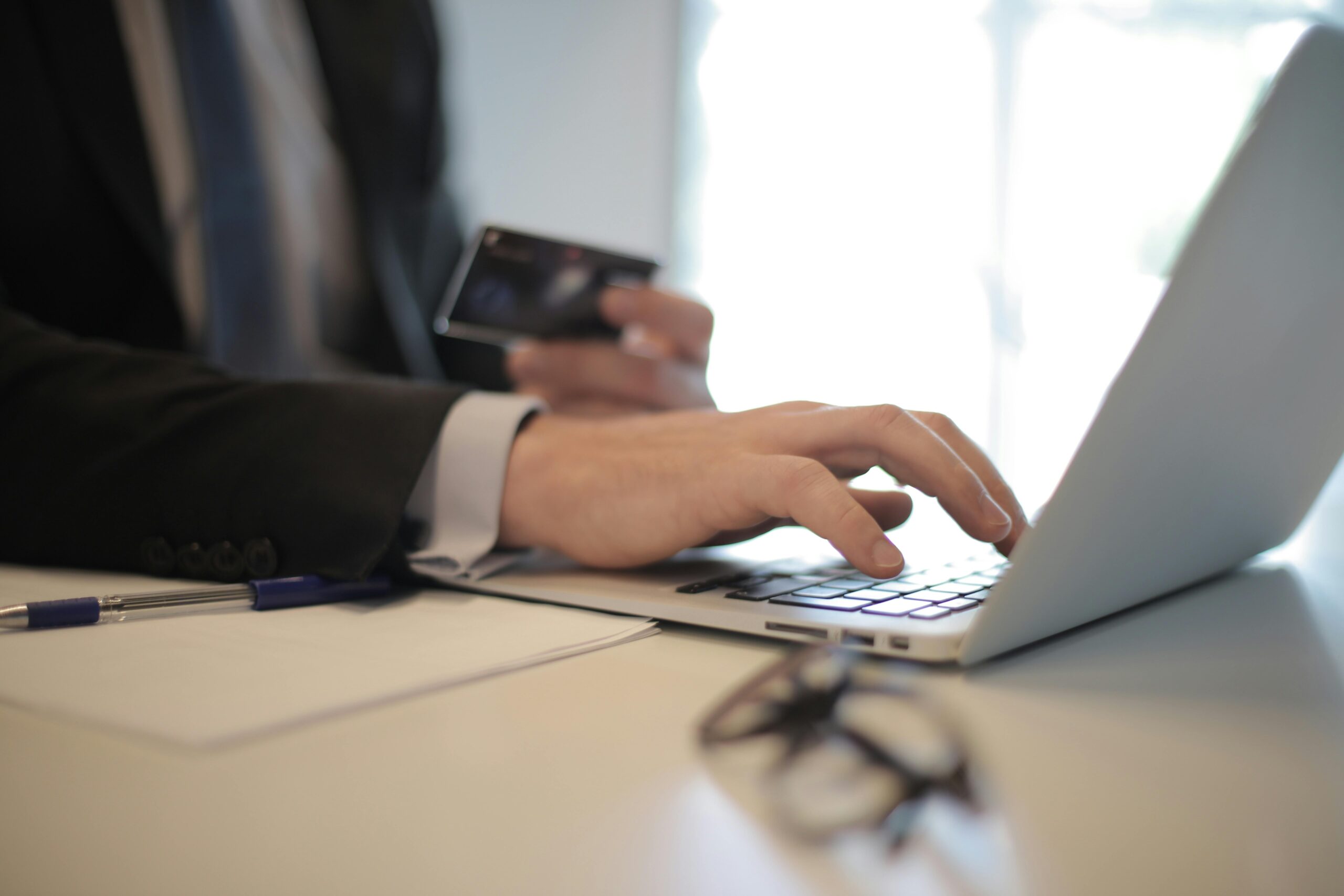 A man typing on a computer.