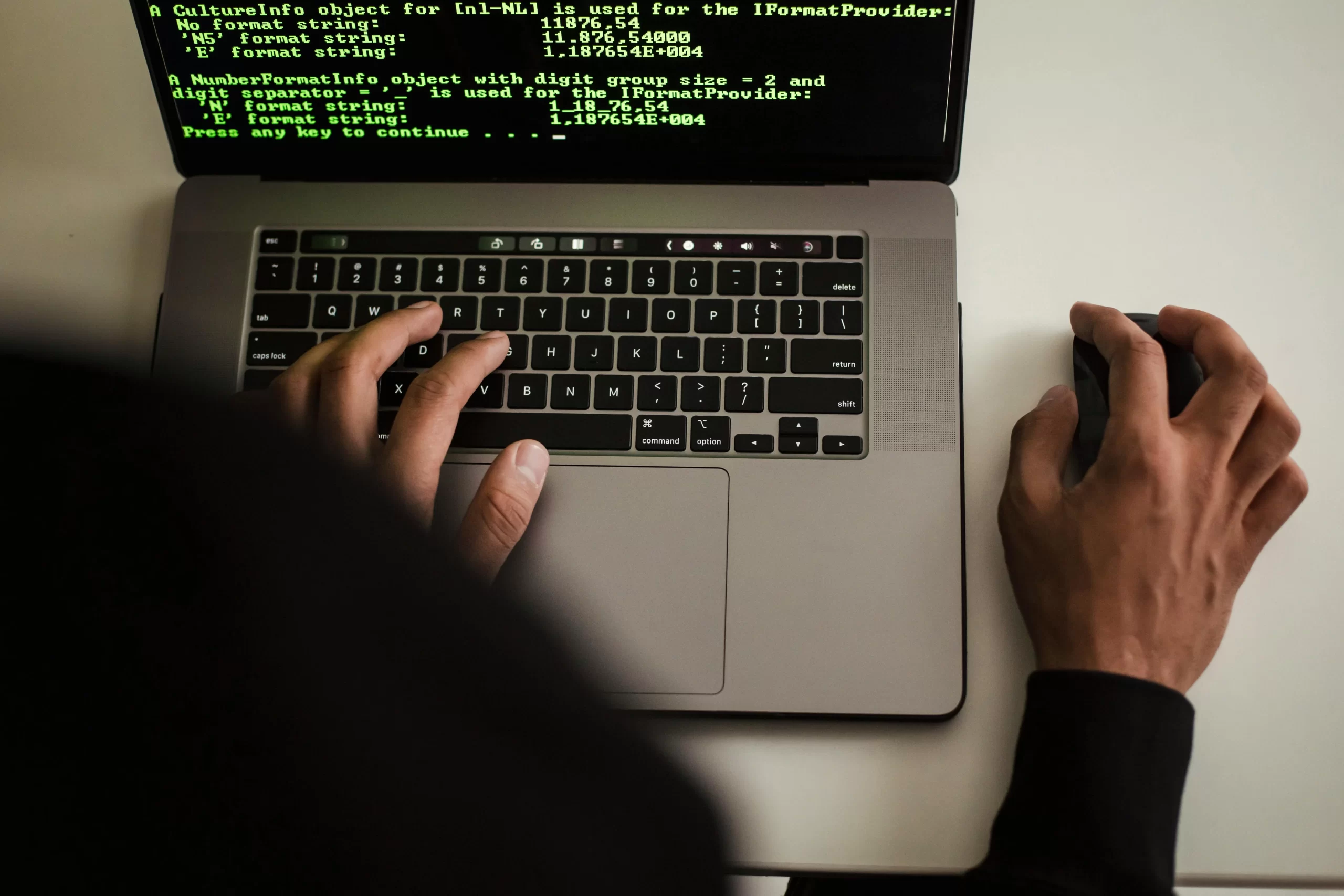 A programmer working on laptop.