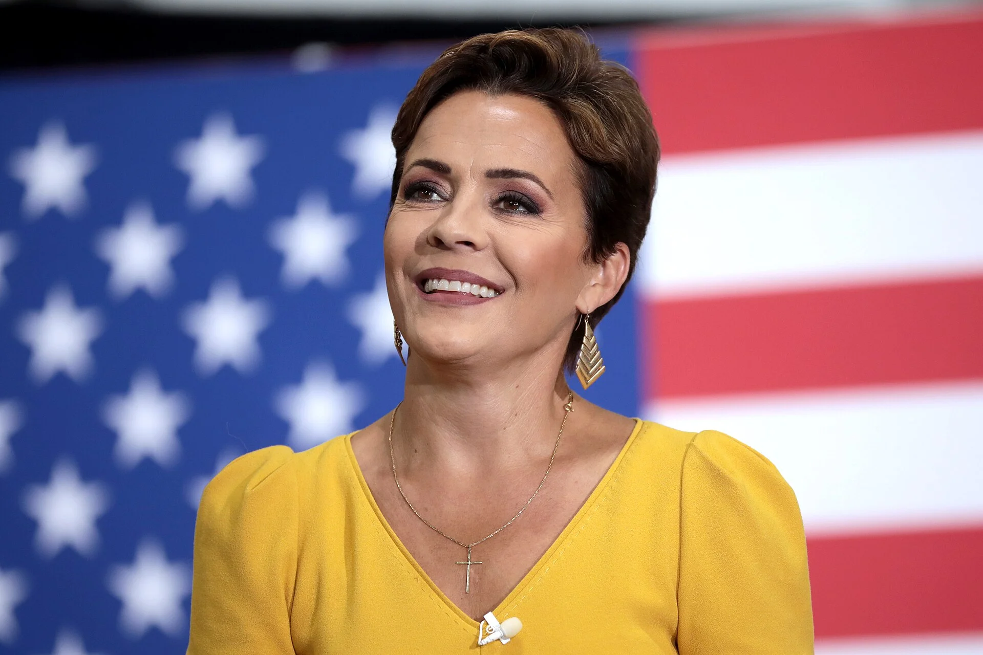 Kari Lake speaking with supporters at a campaign rally at Dillon Precision in Scottsdale, Arizona.