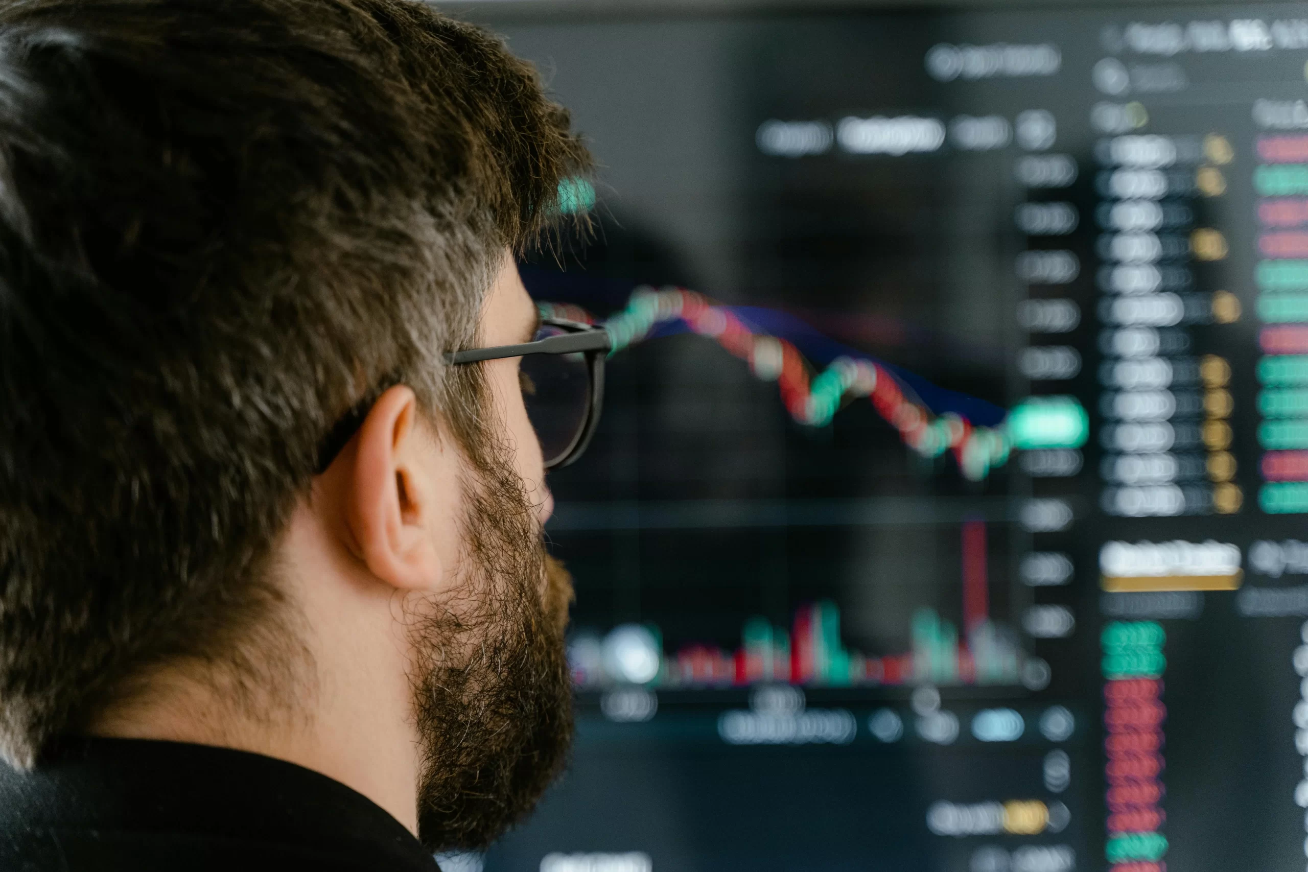A close up shot of a trader watching market chart.