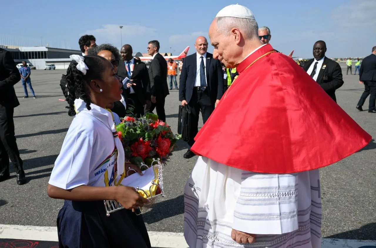 Pope Leo Welcomed by two young girls with flowers in Angola