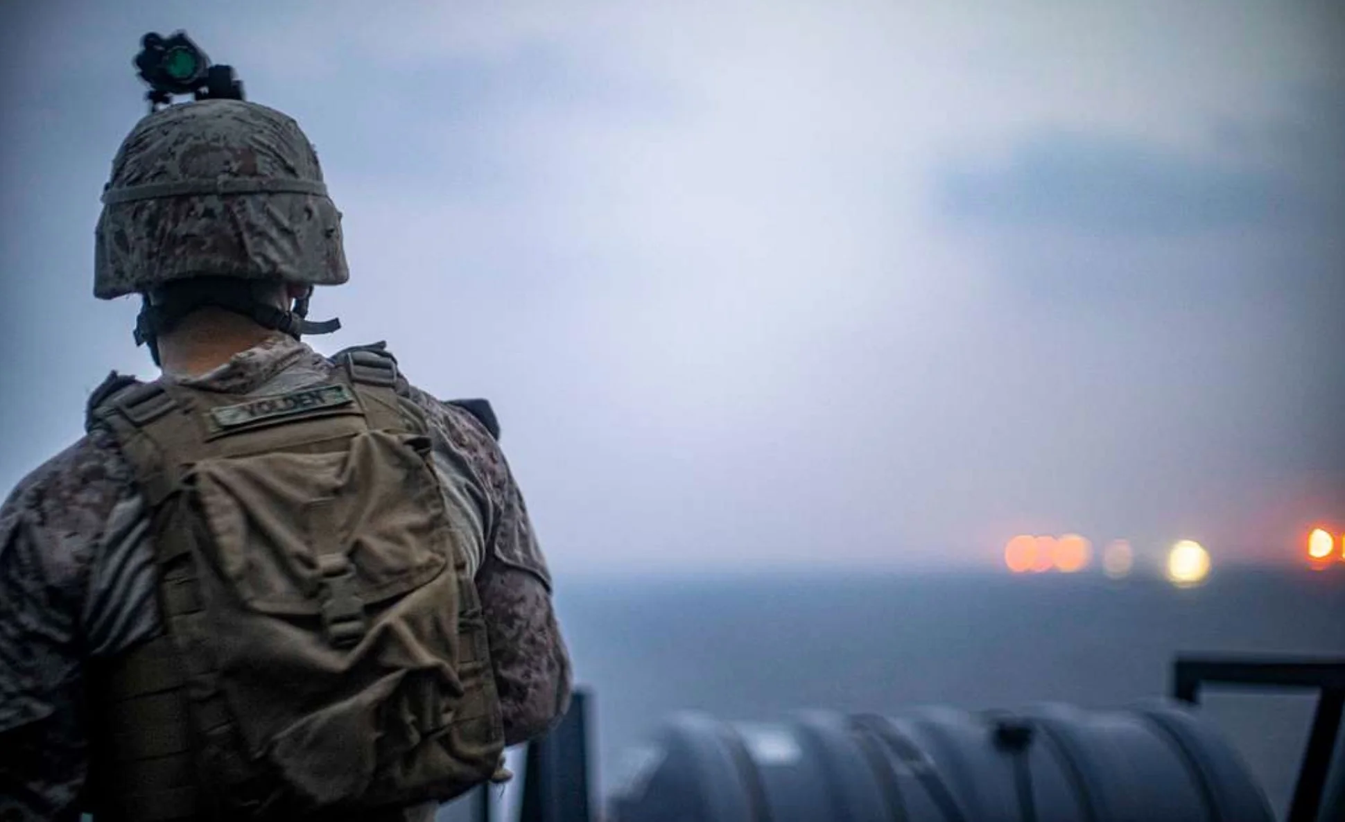 STRAIT OF HORMUZ (Aug. 12, 2019) Lance Cpl. Ryan Volden, observes nearby vessels from the amphibious transport dock ship USS John P. Murtha (LPD 26), during a strait transit. (U.S. Marine Corps photo by Cpl. Adam Dublinske/Released)