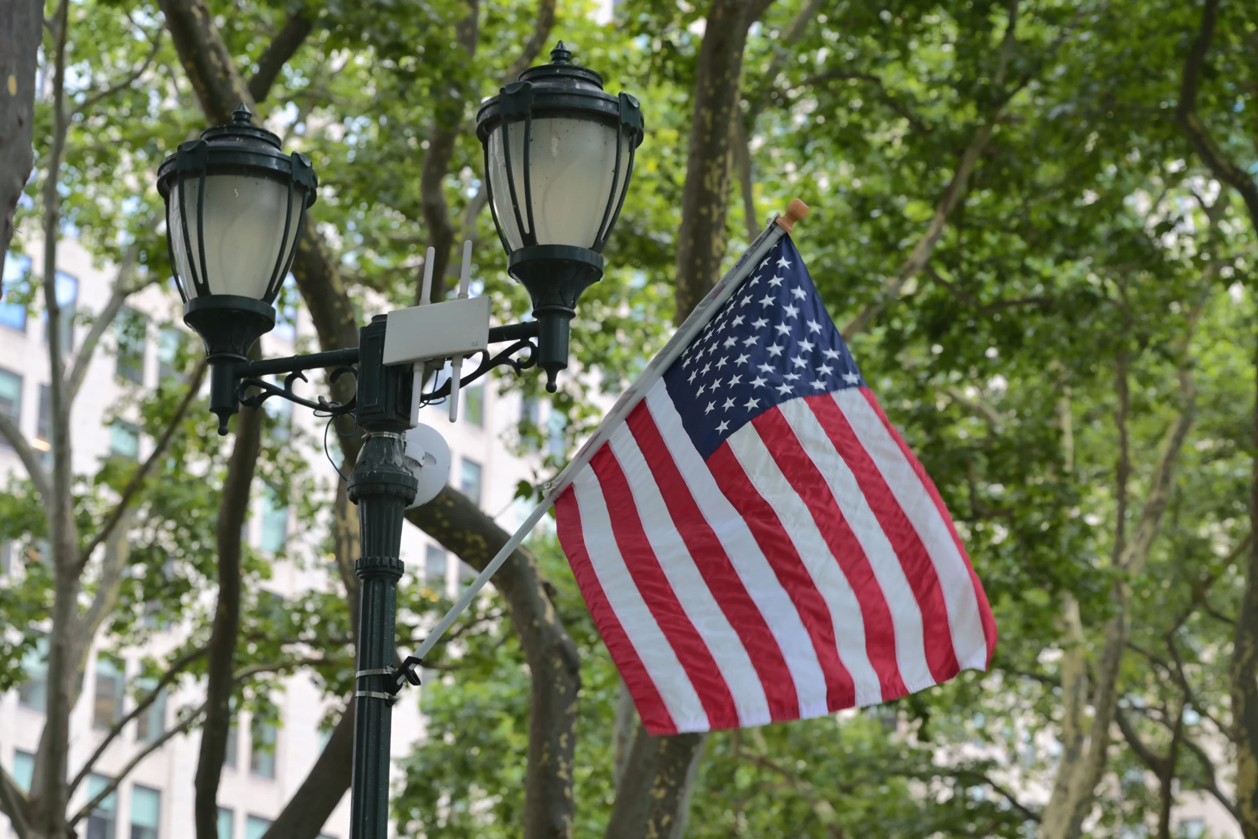 A street lamp with an American flag in New York City.