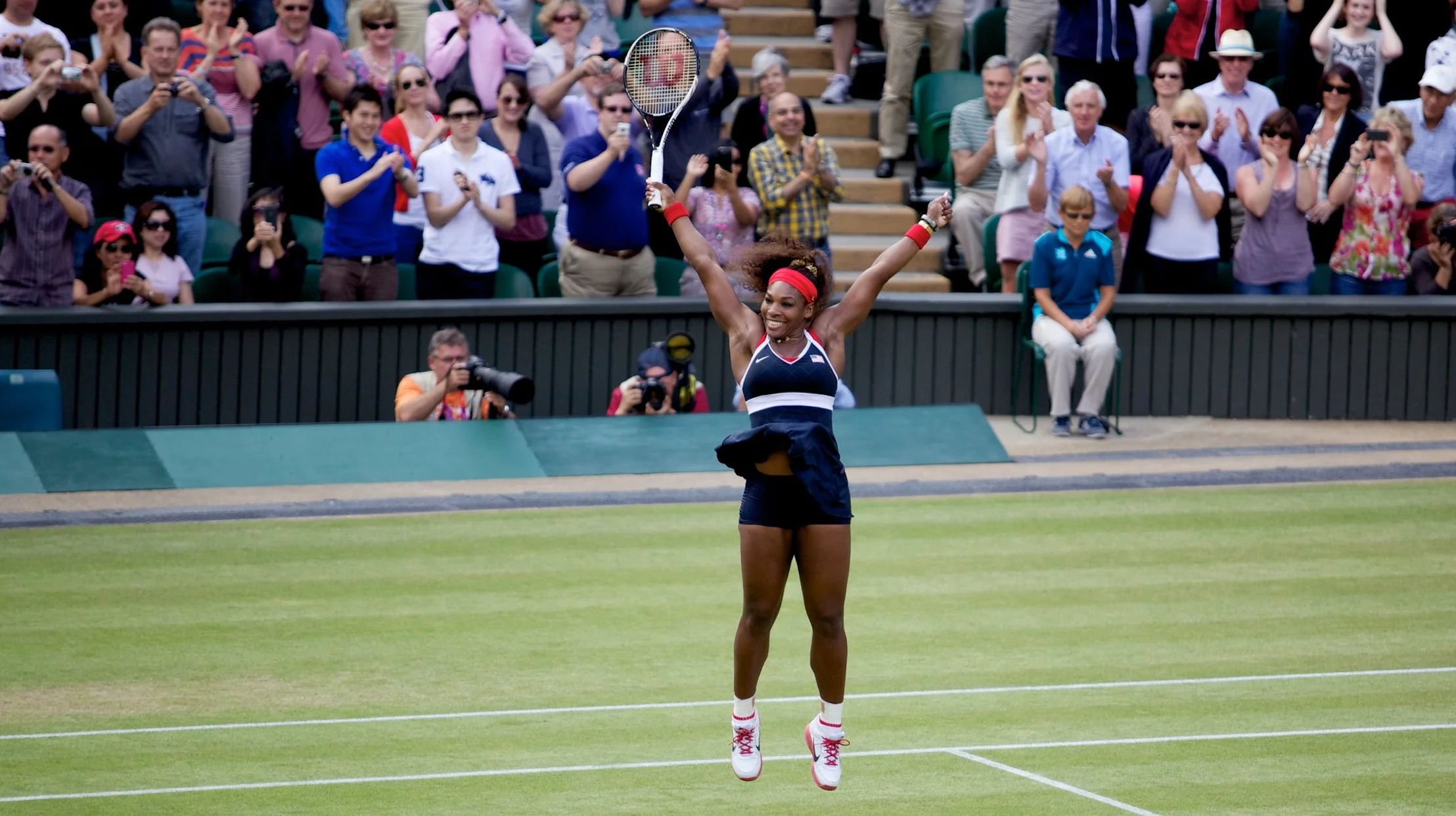 Serena jumps for joy after destroying her opponent, Maria Sharapova in the 2012 Olympic gold medal match.