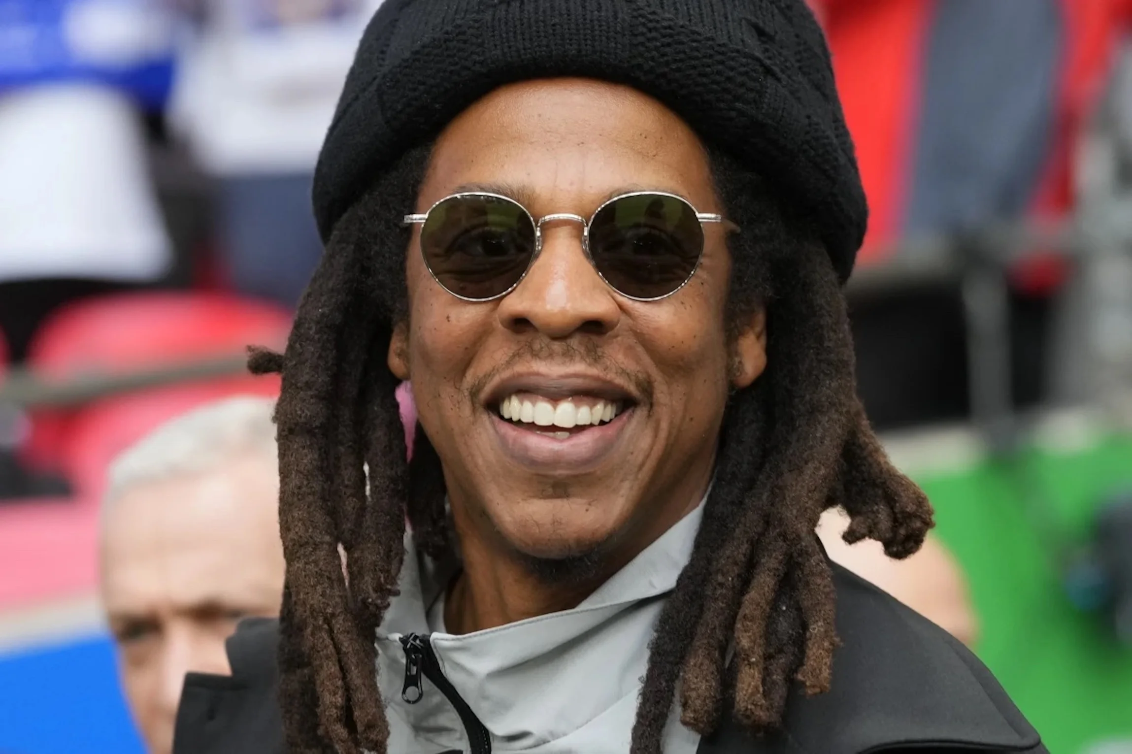 Jay-Z smiles ahead of the Champions League final soccer match between Borussia Dortmund and Real Madrid at Wembley stadium in London