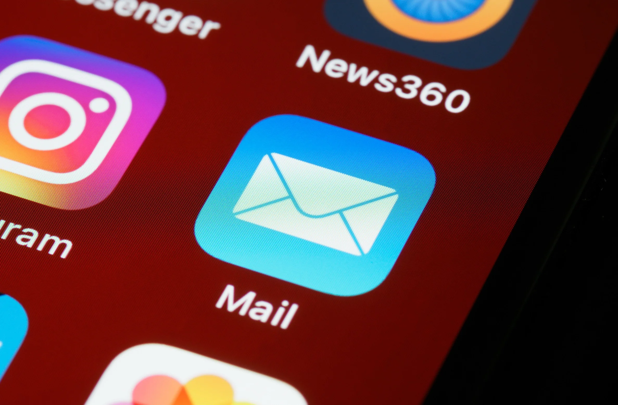 A shot of smartphone screen displaying various app icons including Mail.