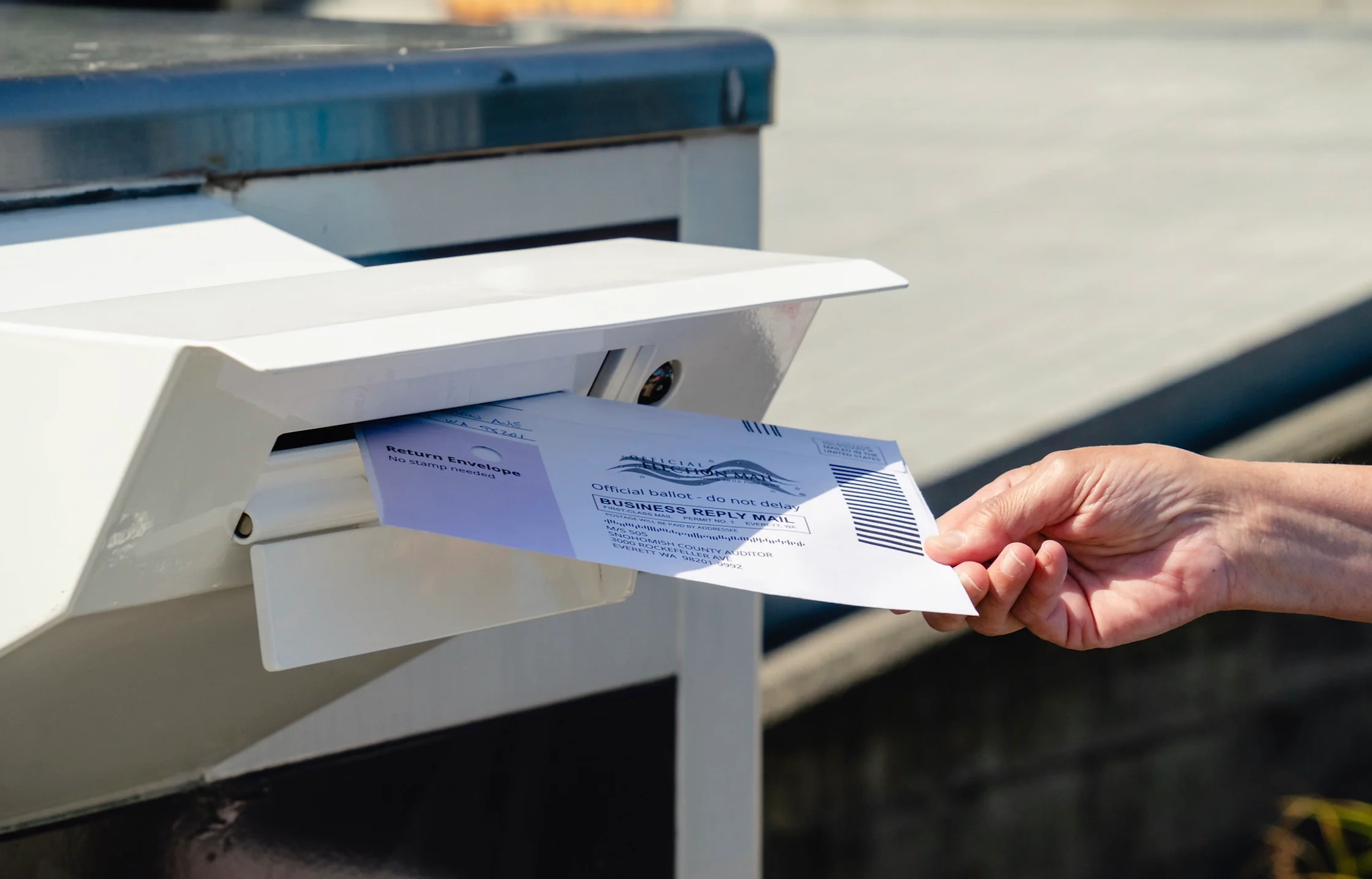 Dropping Mail in Ballot into mail box