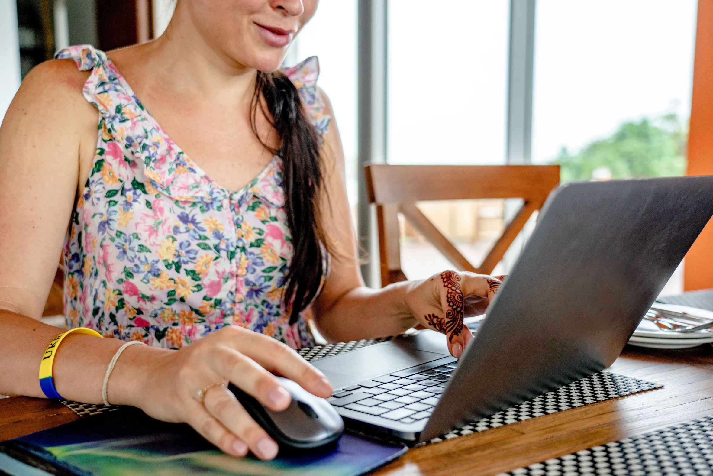 A woman using a laptop for remote work.