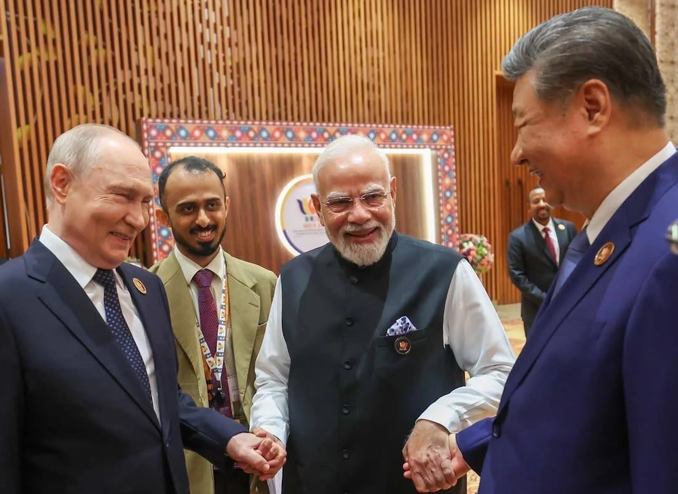 Chinese President Xi Jinping, Russian President Putin and Indian Prime Minister Modi seen laughing together at BRICS Summit.
